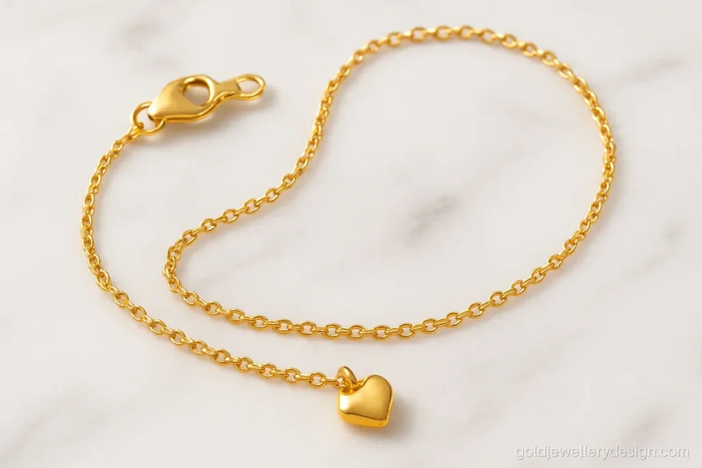 Baby girl gold chain design with a fine cable chain and tiny heart pendant