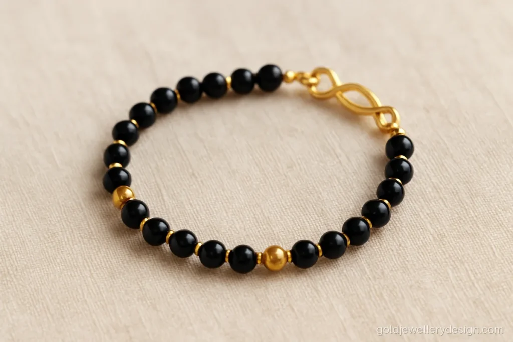Baby boy bracelet gold design, a nazariya with black beads and gold beads