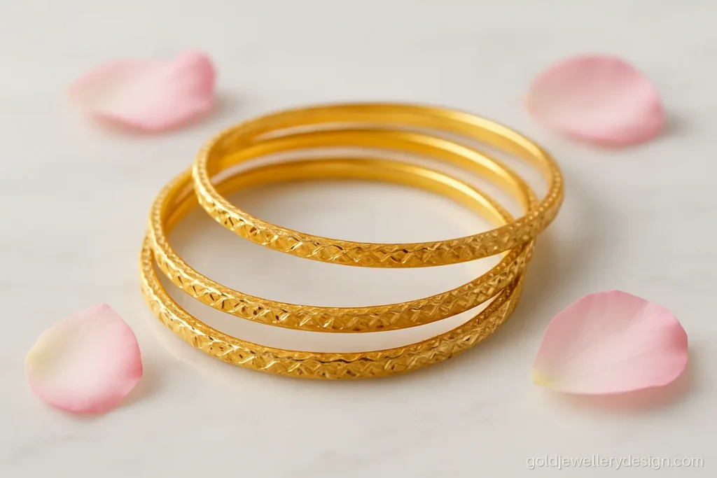 Daily wear modern gold bangles design with four thin diamond-cut bangles