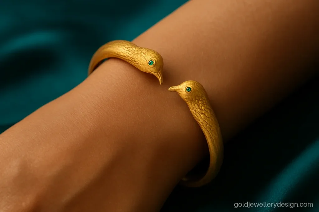Gold bangles new design shaped as an open cuff with two peacock heads