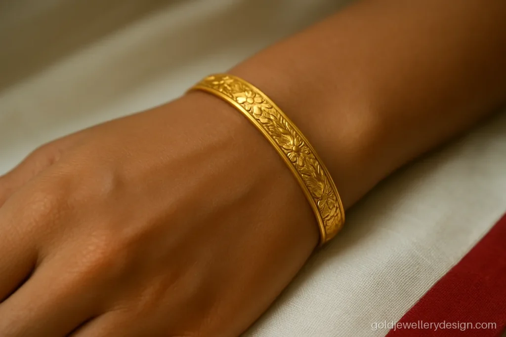 10 gram gold chur design with light floral engraving on a slim band
