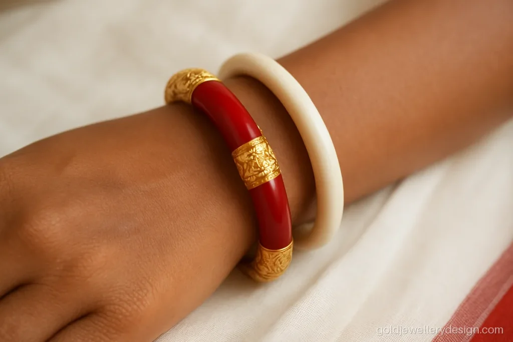 Pola design gold, a red pola bangle with carved gold caps and a centre band