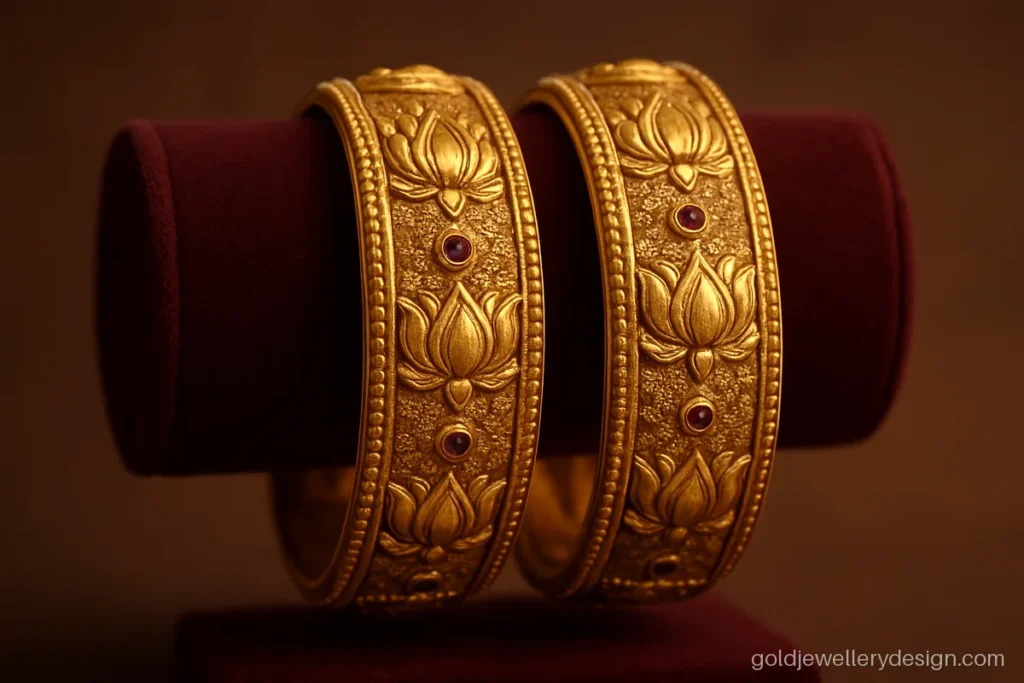 Wedding gold chur design with carved lotus panels and small ruby dots