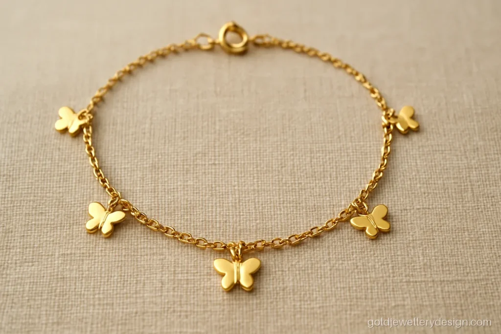 Gold bracelet design for girl with tiny butterflies on a fine cable chain