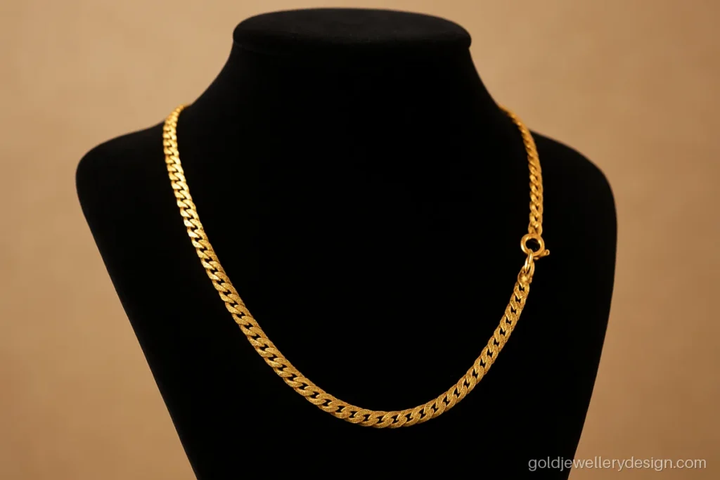 Ladies gold chain design in a flat curb link with diamond cut sparkle
