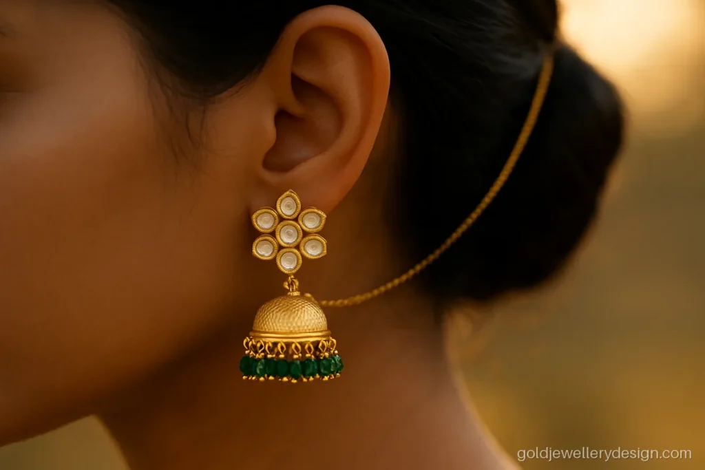Wedding gold earring design with polki-look stones and a sahara ear chain