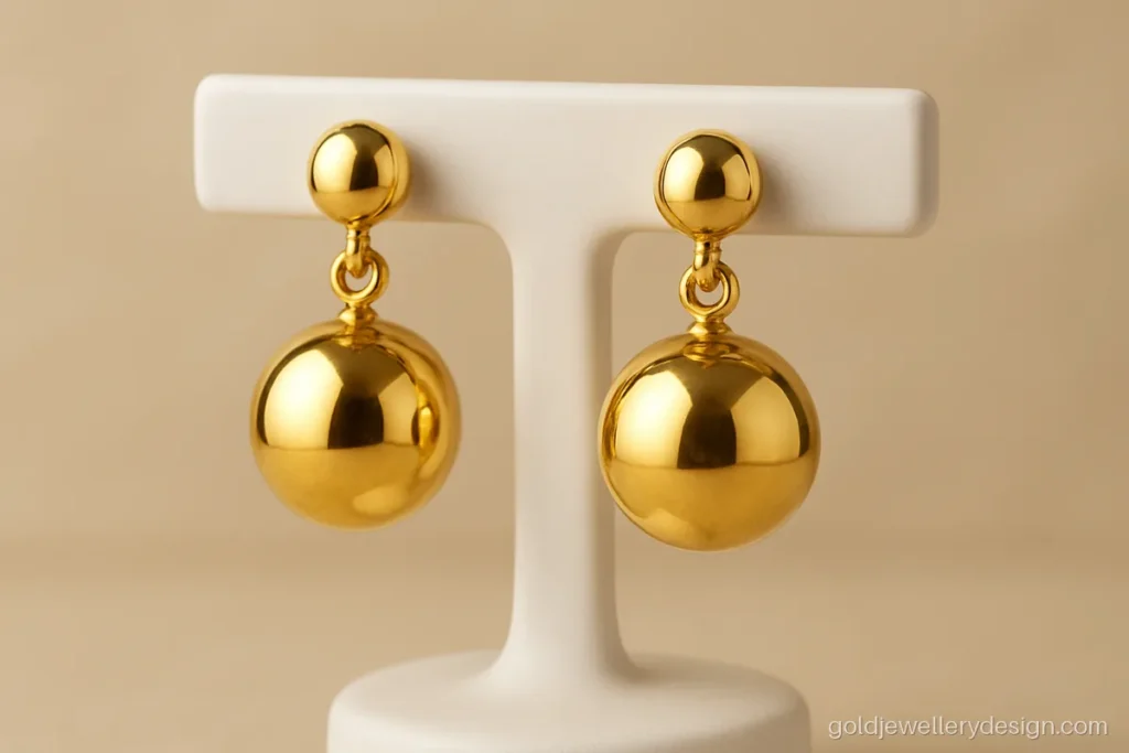 Light weight earrings design gold with a hollow round ball drop