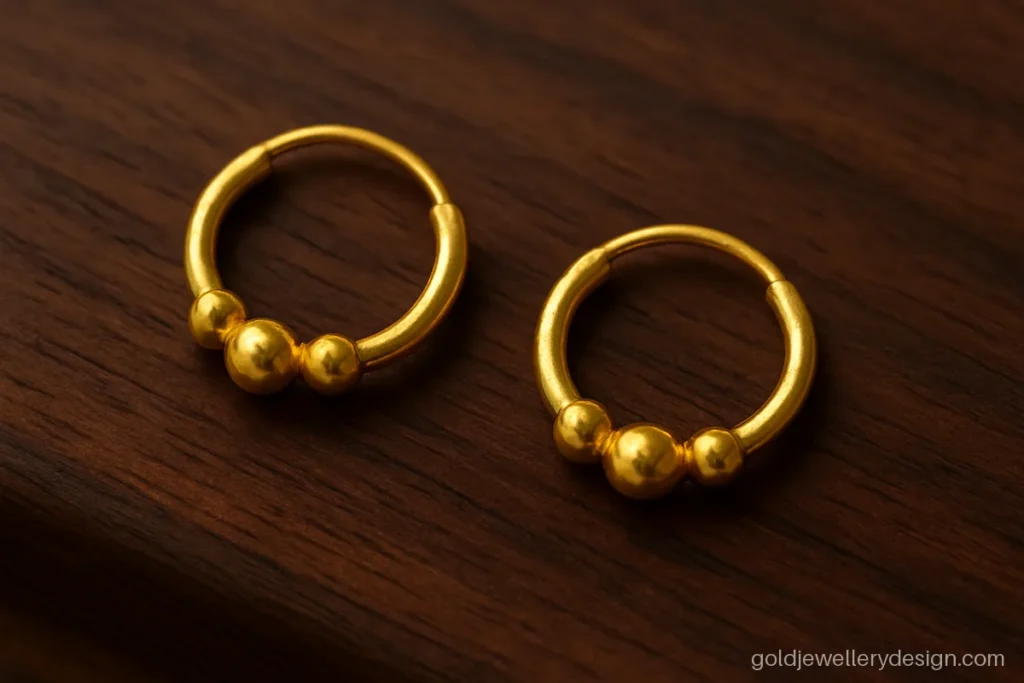 Mini bali hoop with three small gold beads, a light design for young girls