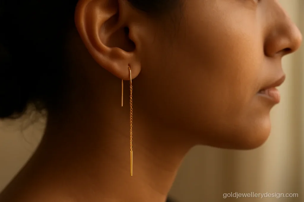 Light gold earring design with a threader chain and a tiny bar end