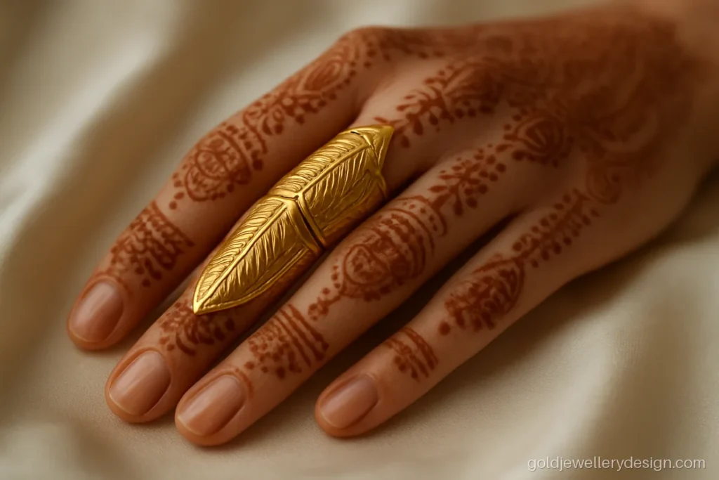 Bridal long gold ring design with a jointed armour style leaf pattern