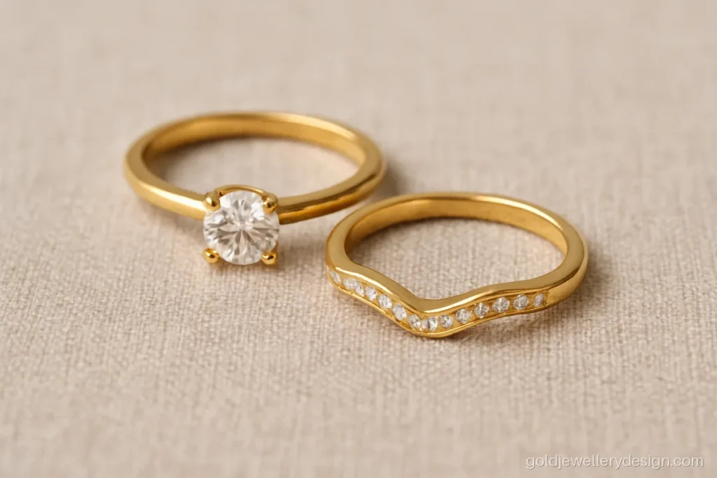 Wedding gold ring design with a curved band that sits beside a solitaire