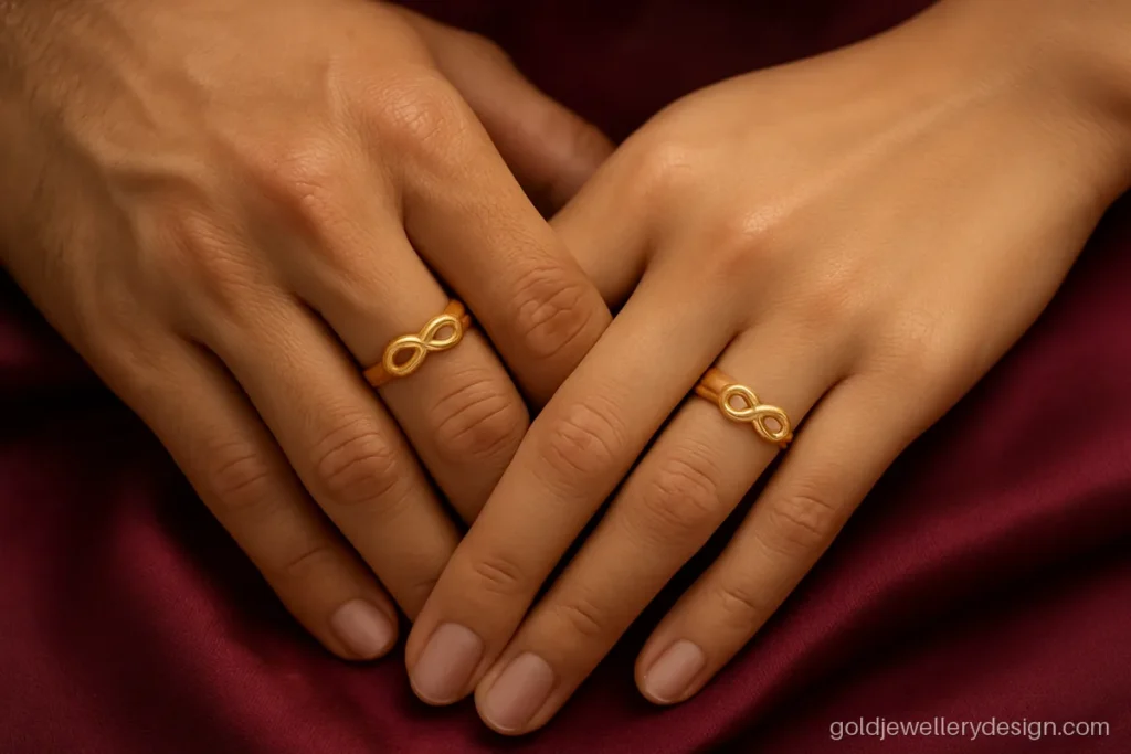 Gold couple ring design with an infinity loop on top of each band