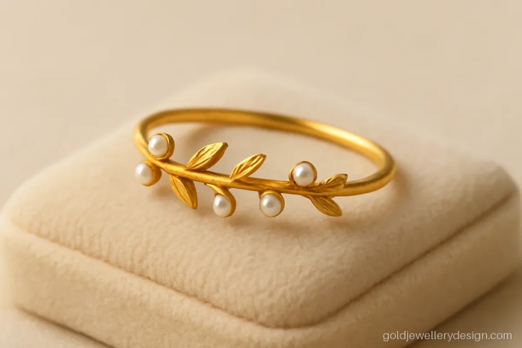 Marriage long gold ring design with a gold vine and small pearls