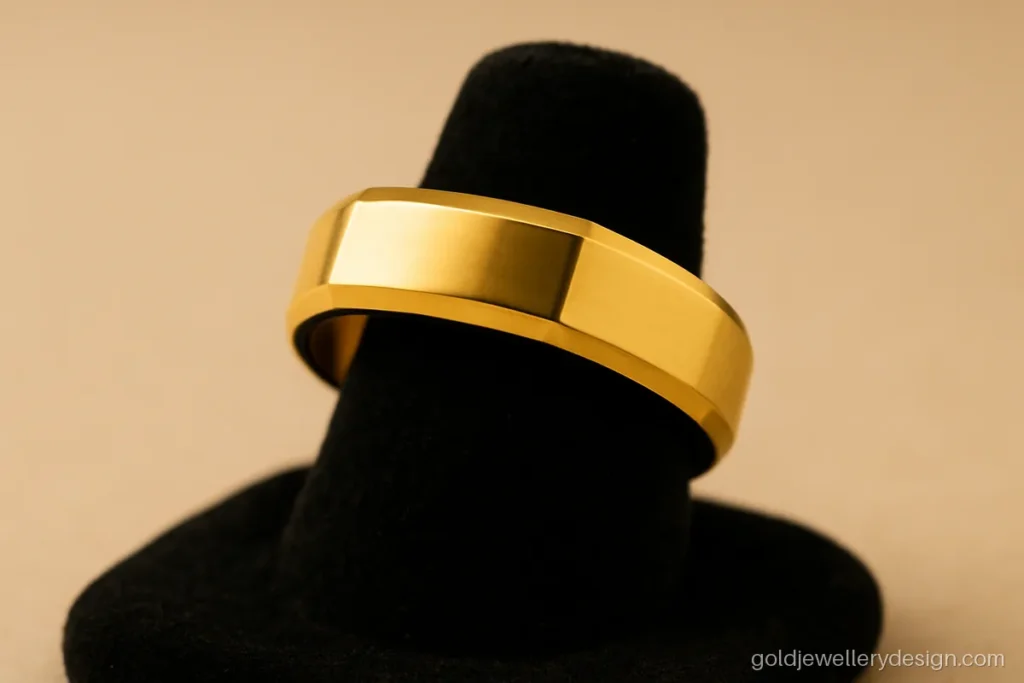 Gents ring design gold with bevelled edges and a polished centre