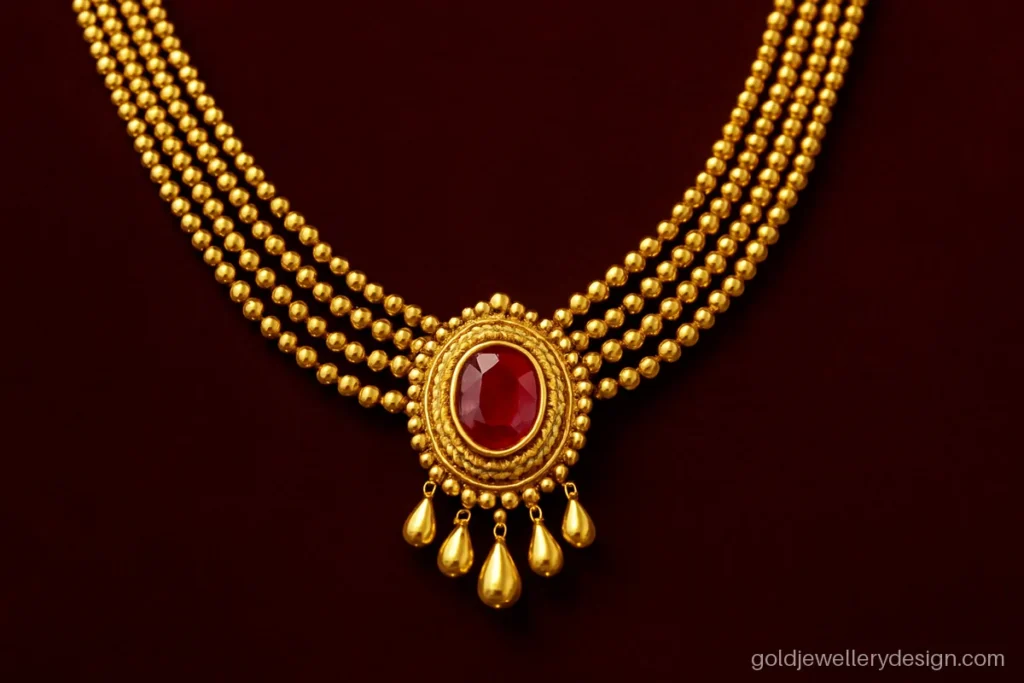 Rani haar gold design with five graded layers and a large ruby pendant