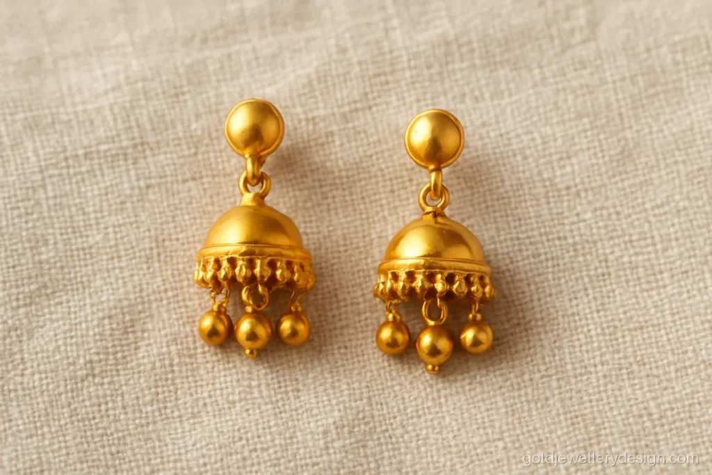 Small jhumki design gold with a plain dome bell and tiny bead drops