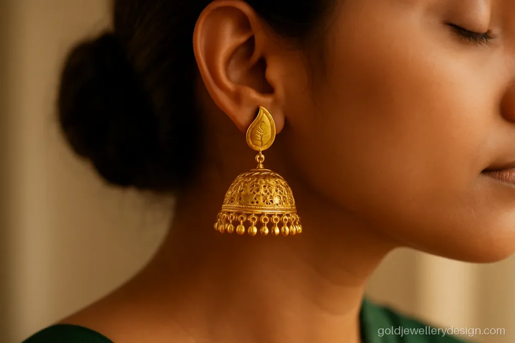 Jhumka gold design with mango kairi shaped stud and filigree bell