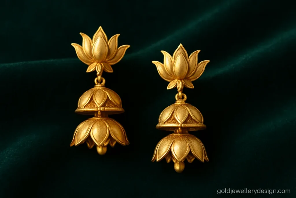 Two layer gold jhumka with lotus stud and two lotus petal bells