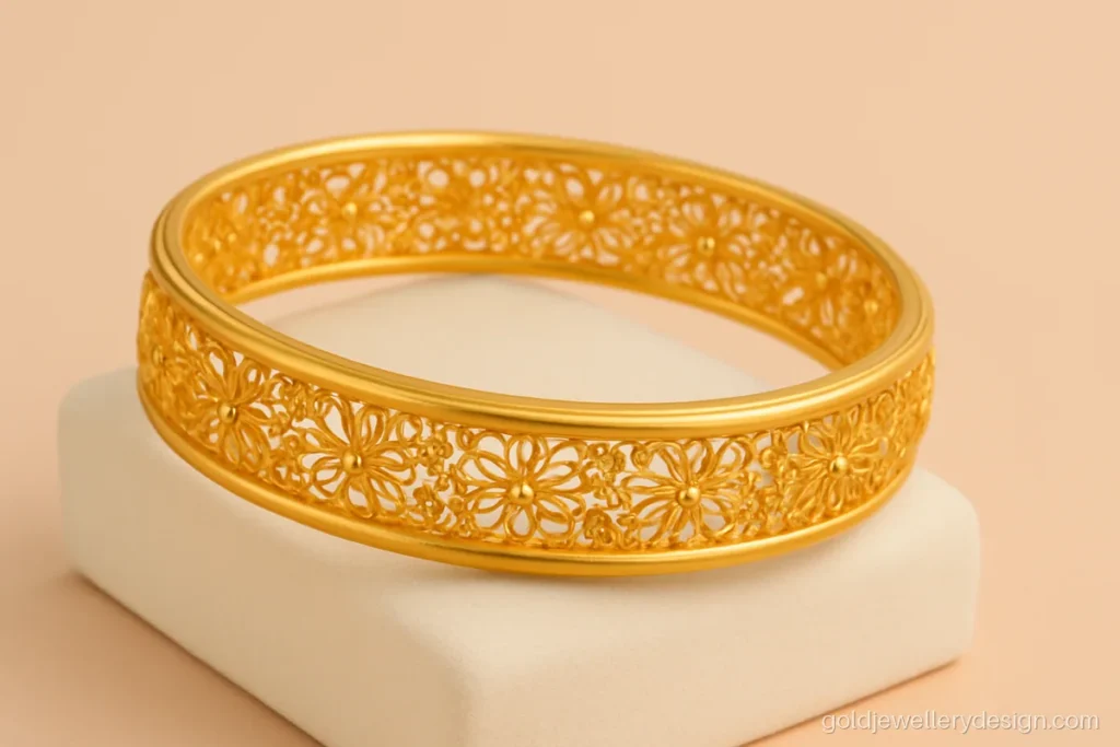 Fancy gold kada design for ladies with open filigree band