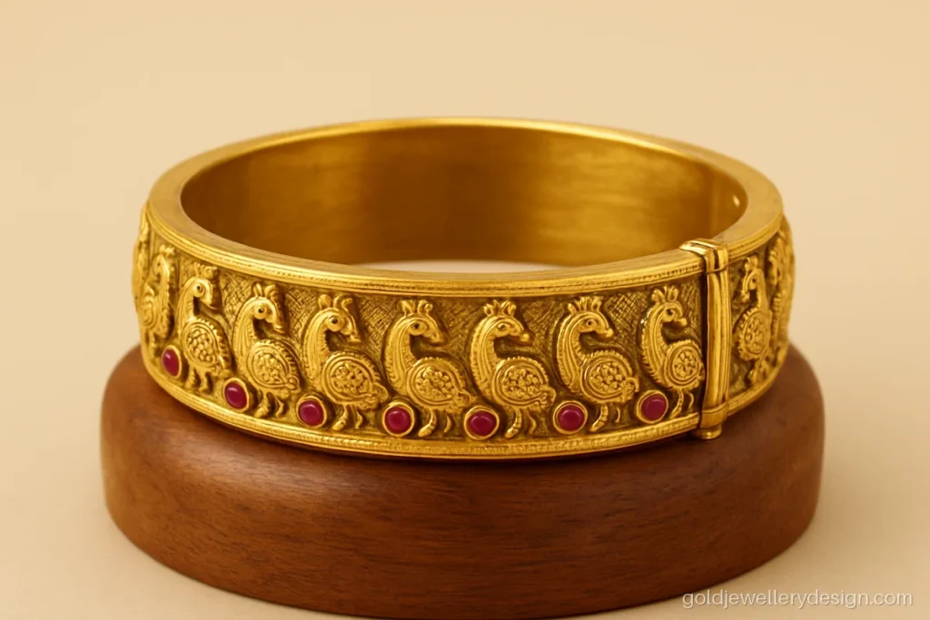 Kangan design gold with peacock motifs, ruby stones and screw opening
