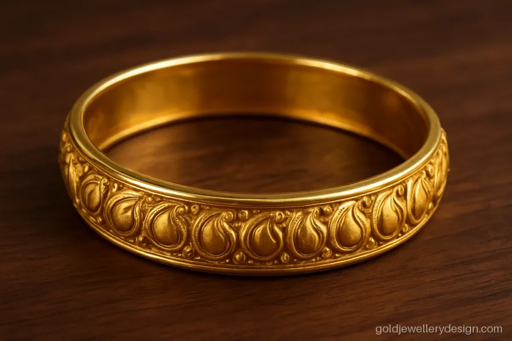 Traditional gold bala design with mango kairi carving all around