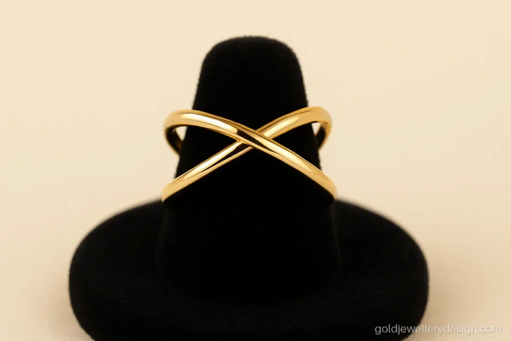 Modern simple gold ring design with two thin lines that cross on top