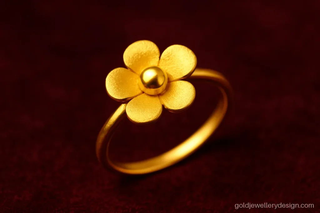 Gold flower ring design with five matte petals and a polished centre