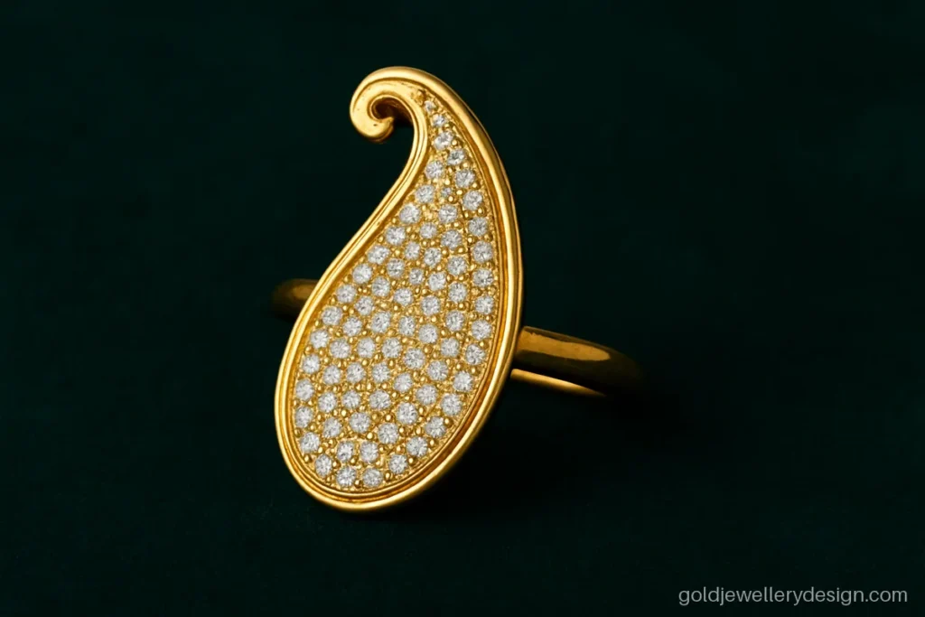 New gold long ring design with a paisley kairi shape and small CZ