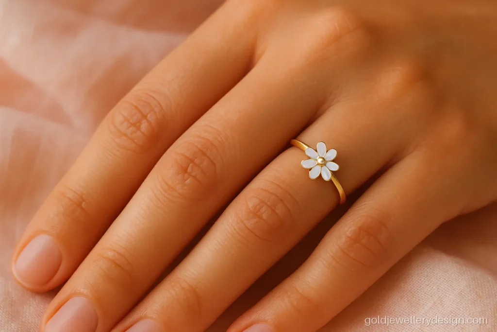 Gold ring design for girl with a small daisy and one white CZ centre
