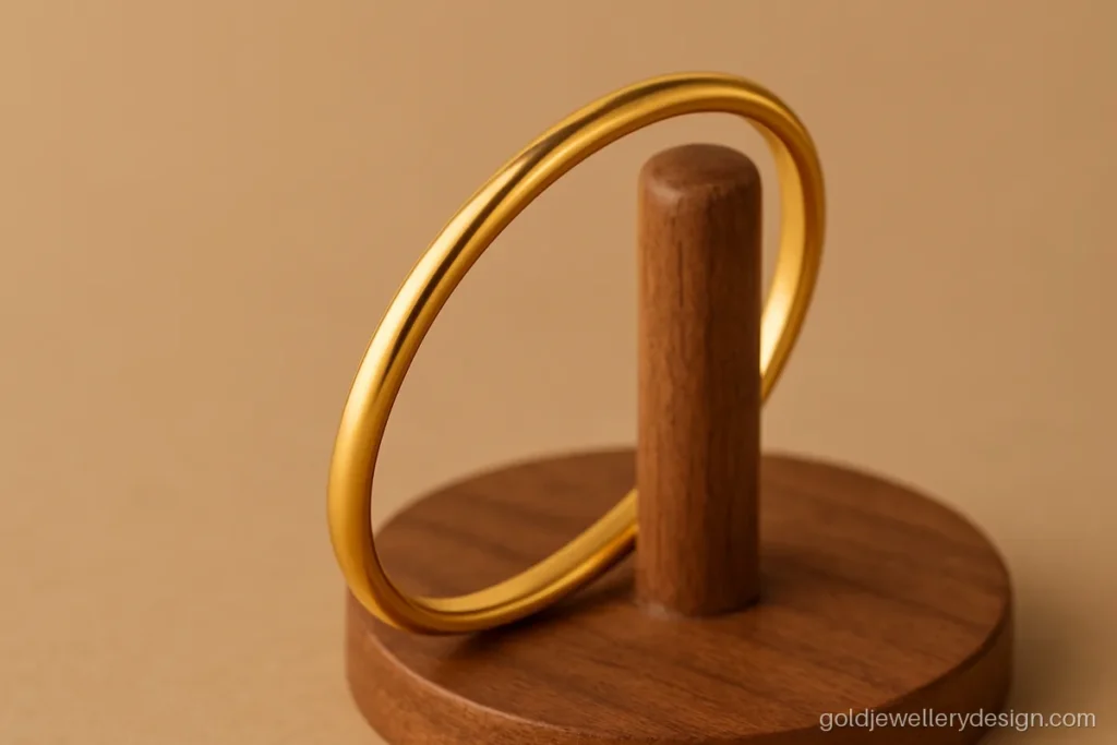 Light gold kada for boys with a smooth finish and rounded edges