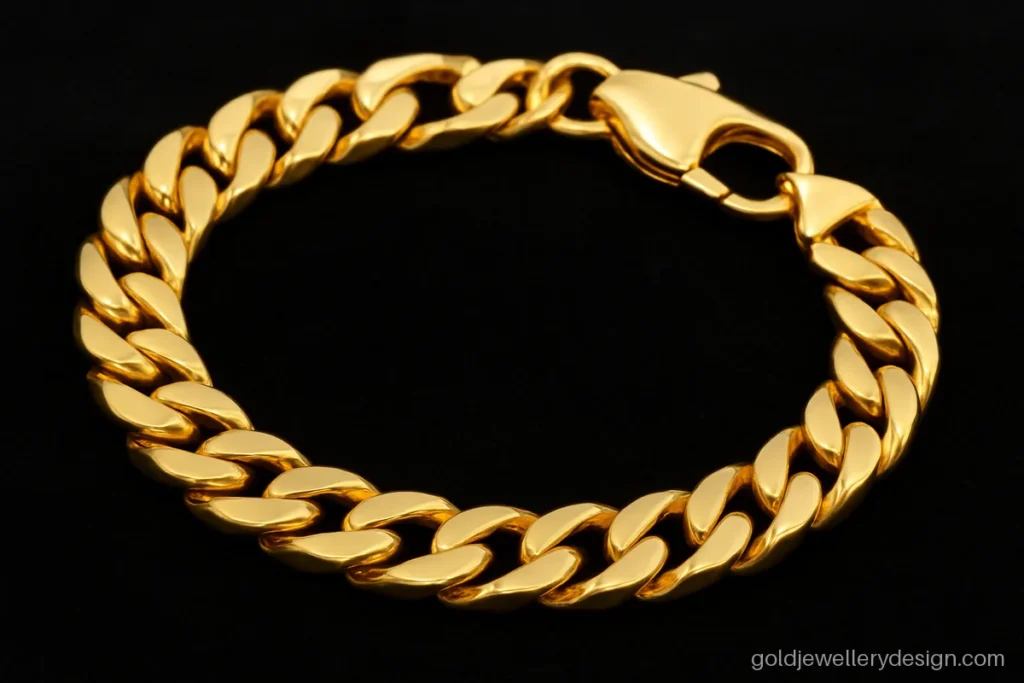Gold bracelet design for men in a thick curb link with a lobster clasp