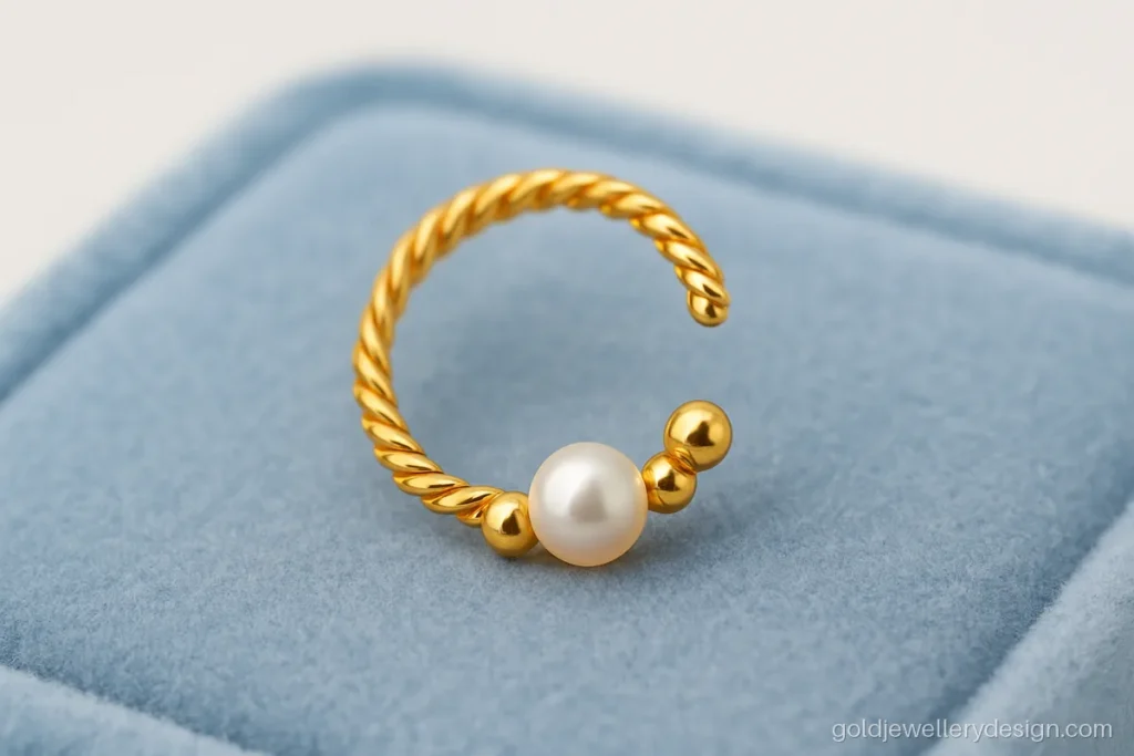 Gold nathiya design with twisted wire hoop and a tiny pearl