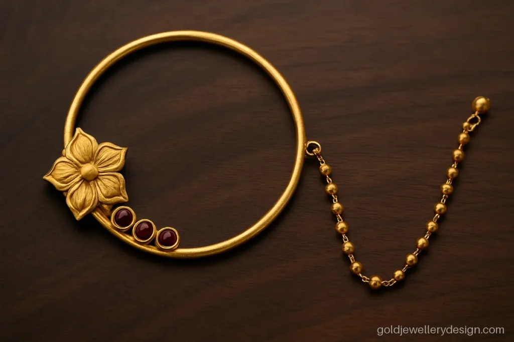 Gold pahadi nath design with very large round ring and carved panel