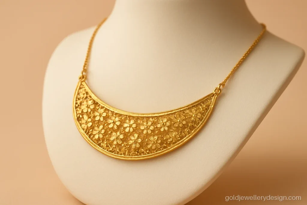 Light gold necklace with a cutwork flower net that sits flat on the neck