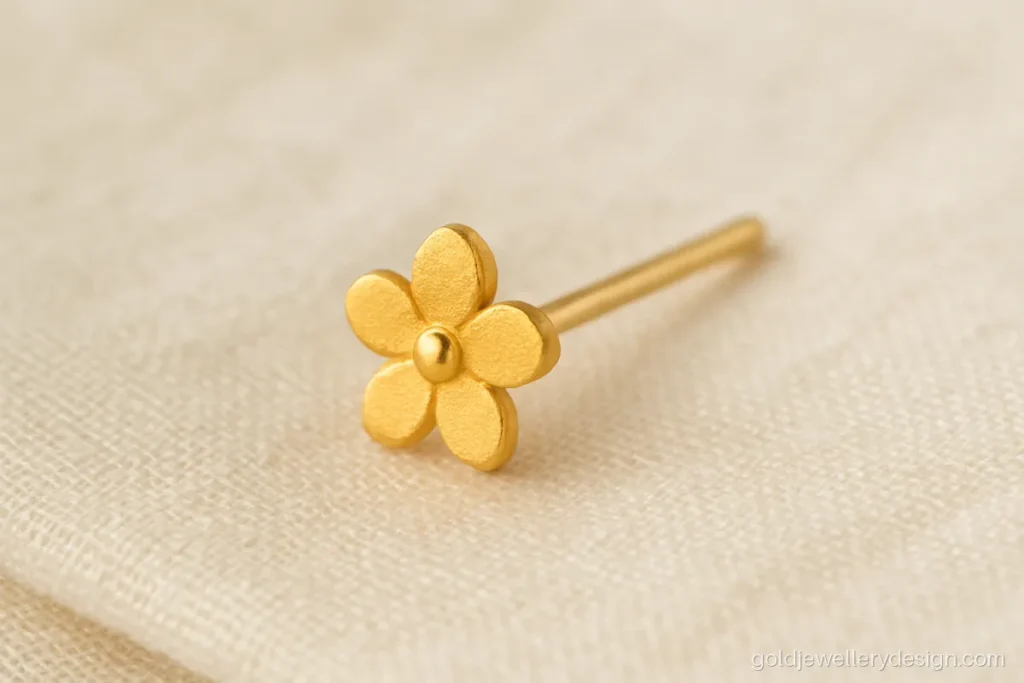 Gold nose pin stud with a five petal flower in matte finish