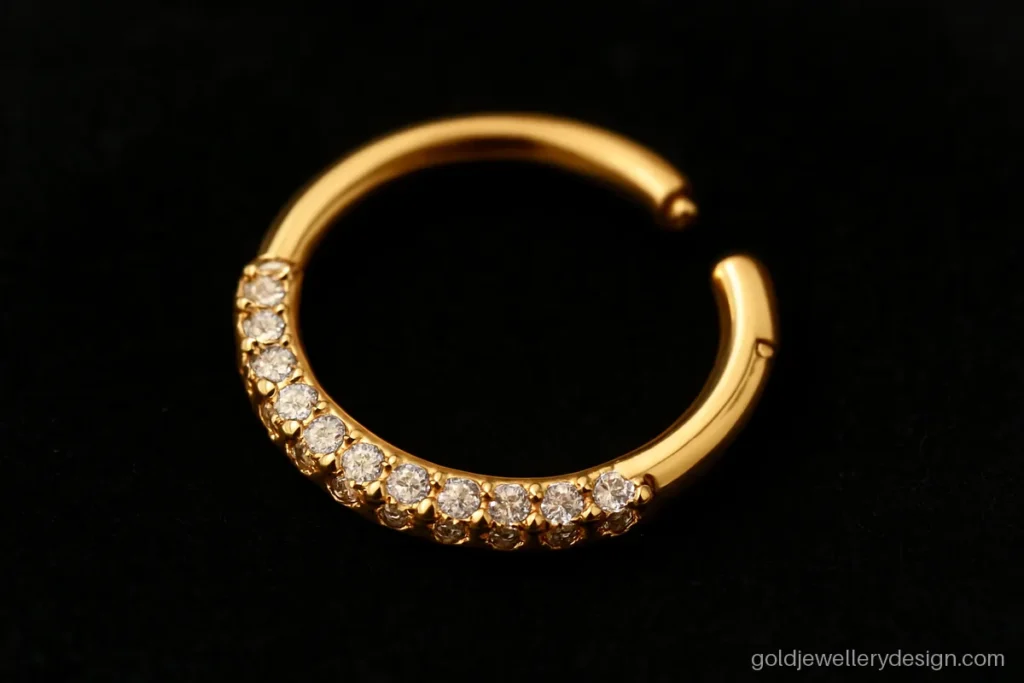 Hinged gold nose ring with a row of tiny CZ stones on the front half