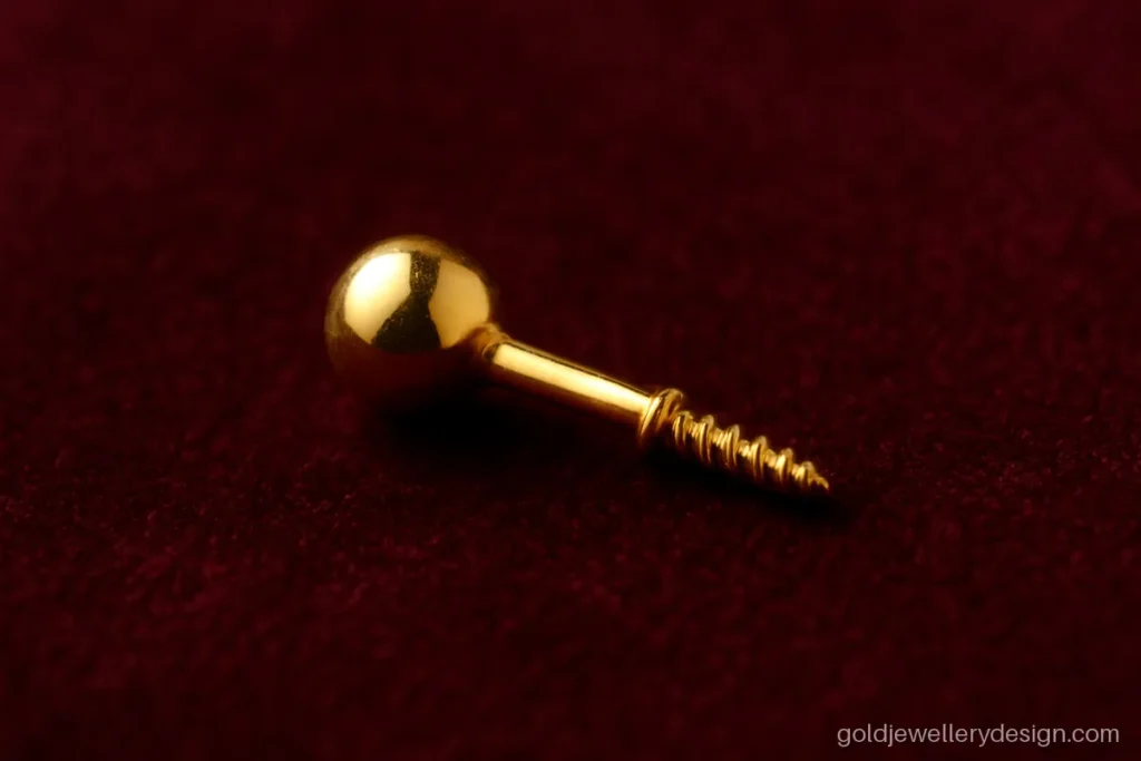 Tiny gold nose pin stud with a single polished ball and screw back