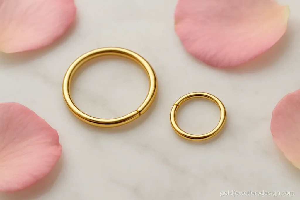 Simple gold nose ring design, a thin seamless hoop with high polish