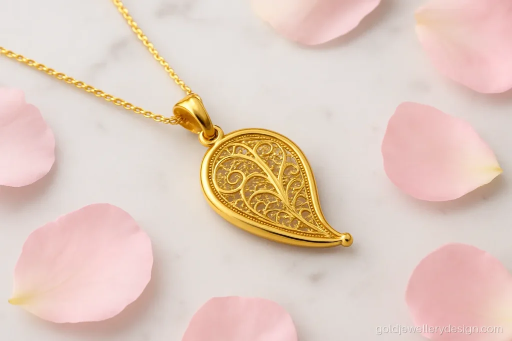 Gold chain dollar design in a mango kairi shape with open filigree work