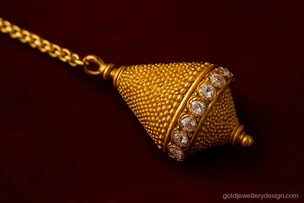 Borla design gold, a smooth cone shaped forehead piece with fine granulation