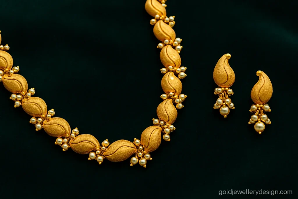 Long bridal gold haar with kairi mango motifs, creamy pearls and matching earrings