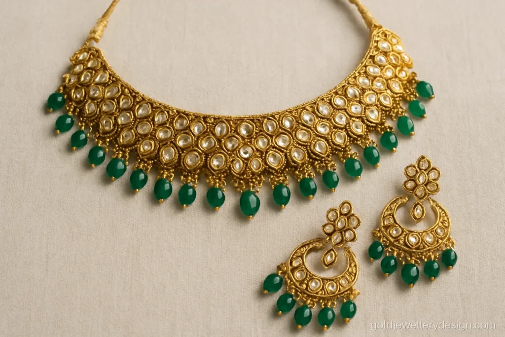 Bridal gold set design with polki-look stones, emerald drops and chandbali earrings