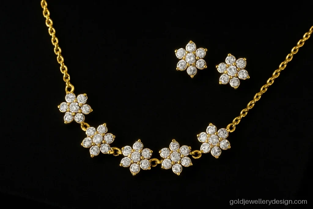 Gold kitty set design with white CZ flower clusters and matching studs