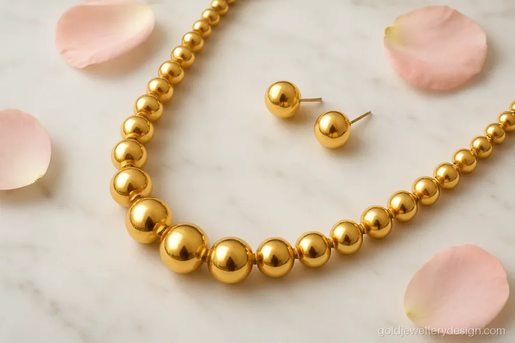 Gold set design with a hollow bead mala and matching round tops