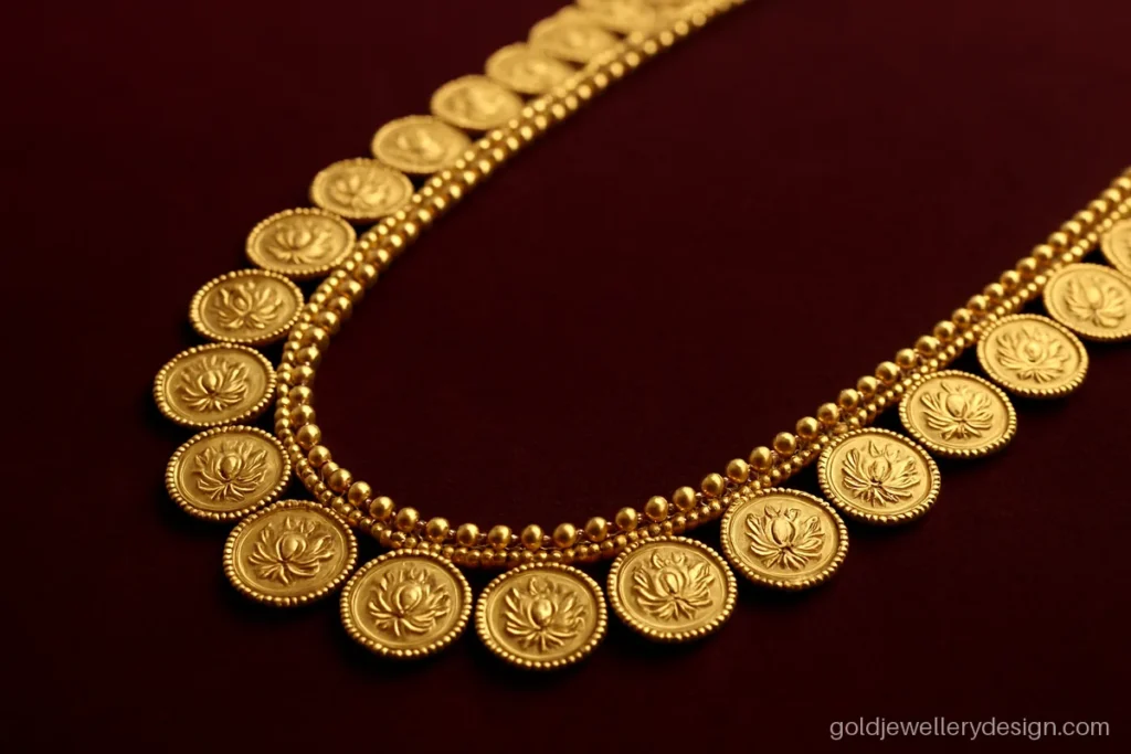 Kasu malai gold design with small lotus pattern coins on a long chain