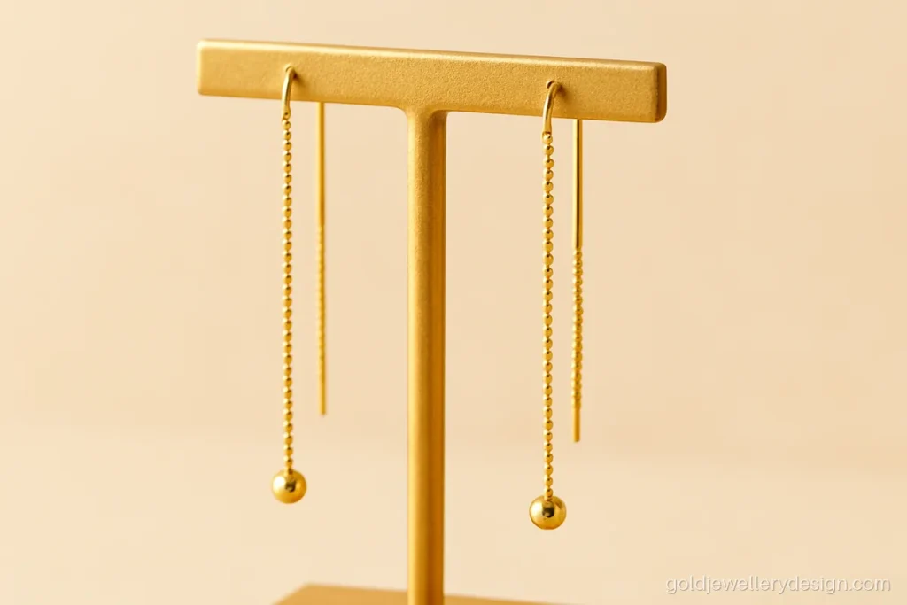 Sui dhaga gold design made with a ball chain and two small bead ends