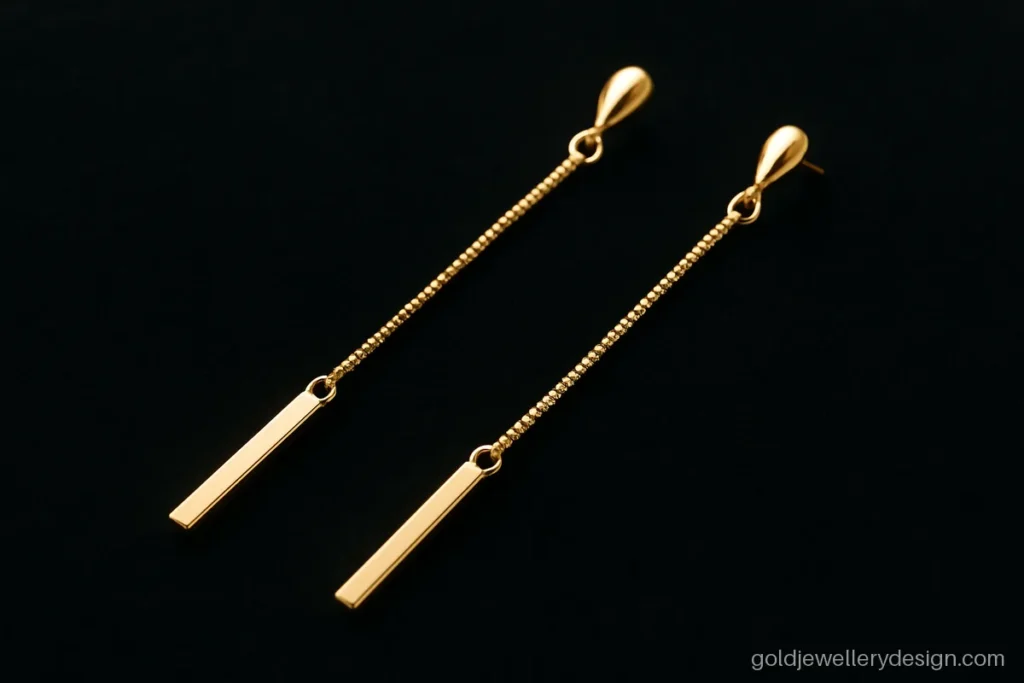 Fancy gold earrings sui dhaga design with a box chain and a slim bar end