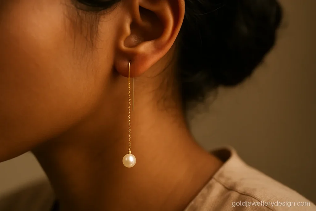 Sui dhaga gold earrings design with a single creamy pearl drop
