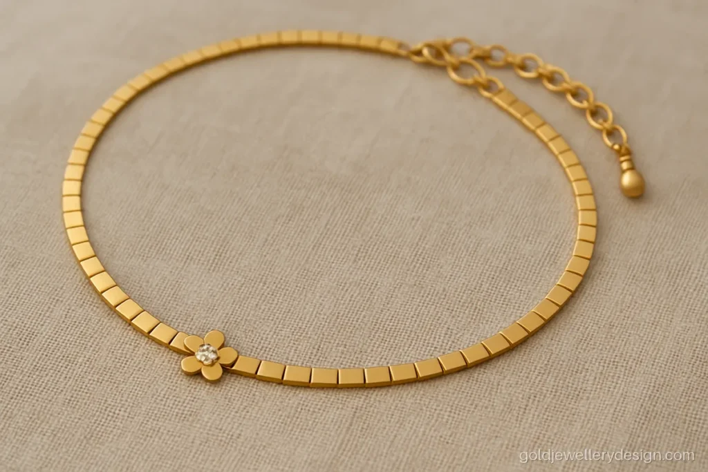 5 gram gold choker design with thin flat links and a tiny flower centre