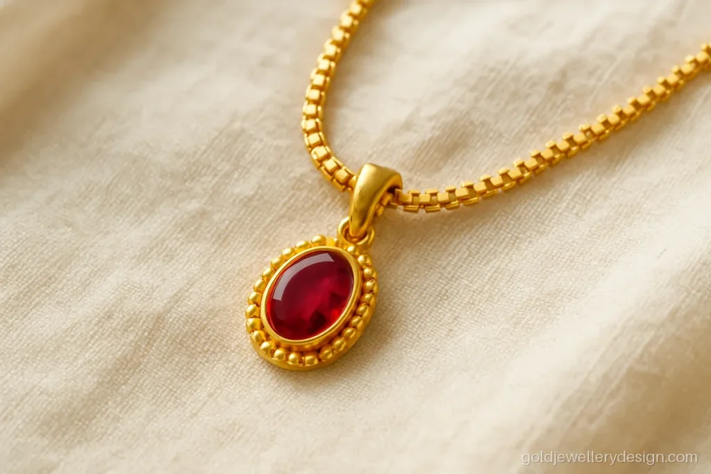1 tola gold necklace design with a small ruby pendant on a box chain